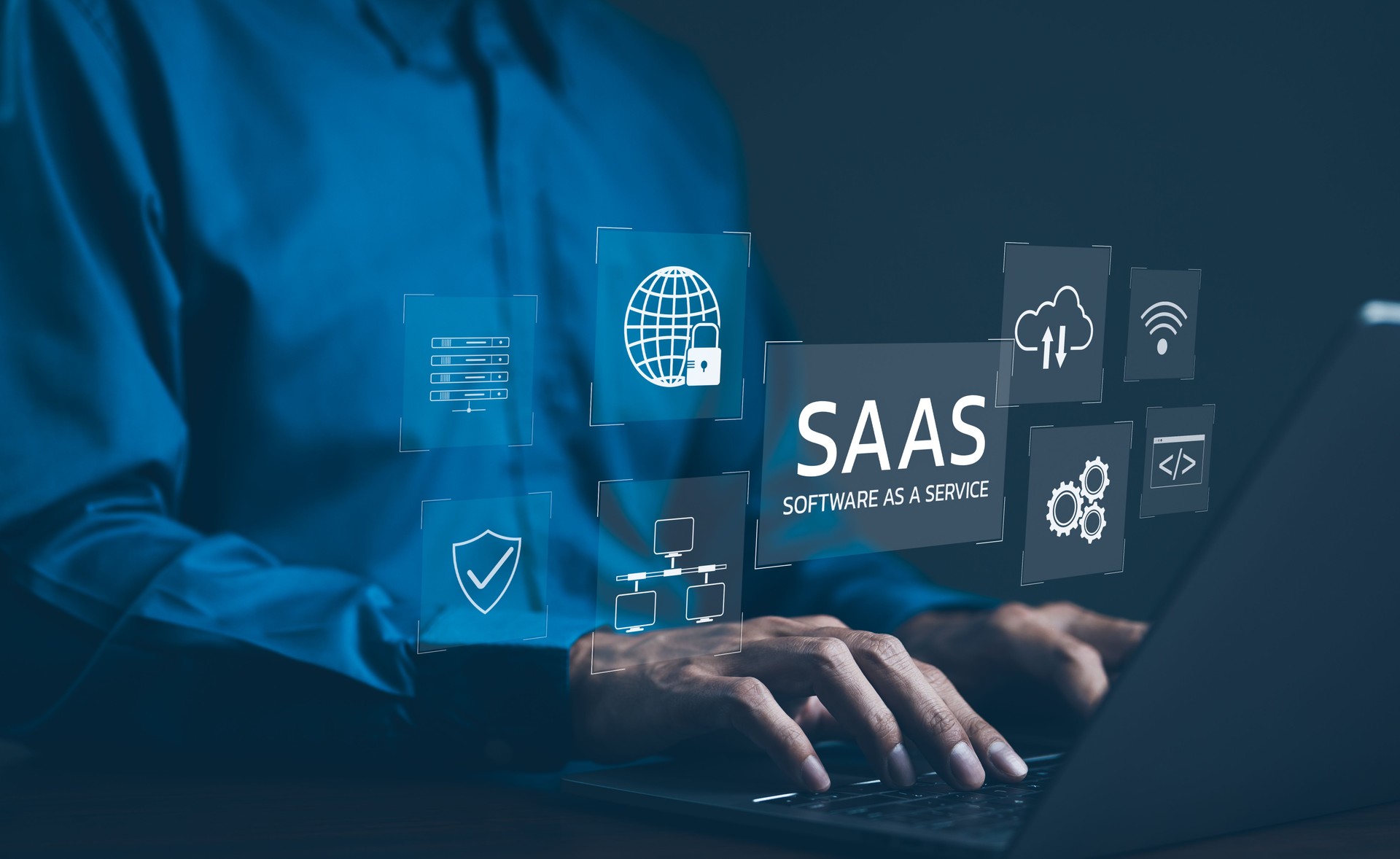 SaaS Concept, Software as a Service, A man types on laptop with digital icons representing various aspects of Software as a Service (SaaS), emphasizing modern technology platforms and cloud computing.